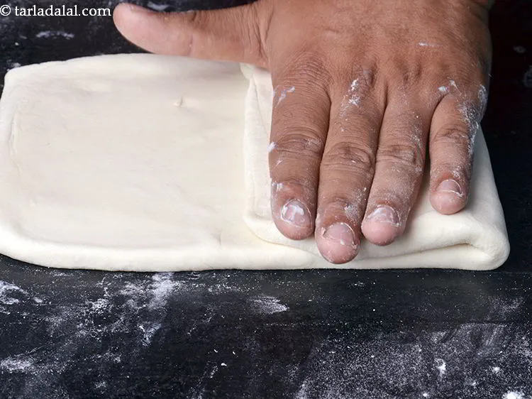 Step 21 – Again fold one side of the rectangle till the centre.