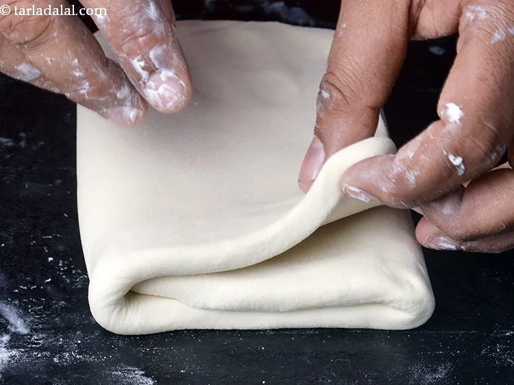 Step 22 – Then fold the other side overlapping the first side.