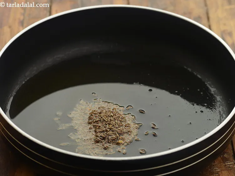 Step 15 – When the oil is hot, add the cumin seeds.