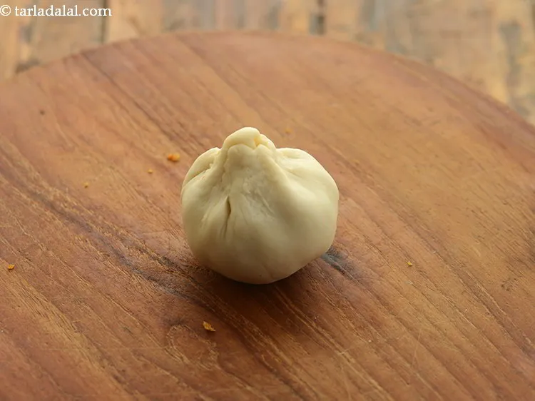 Step 29 – Bring together all the sides to form a potli like structure.