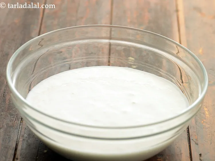 Step 3 – To make <strong>Gujarati Khatta Dhokla</strong> batter, in a deep bowl take the idli batter.