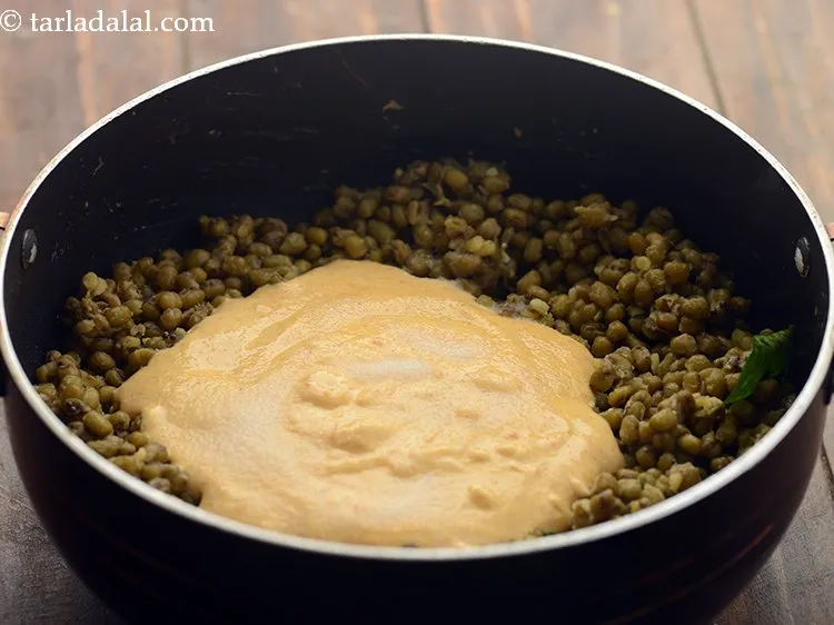 Step 21 – Add the curds-besan mixture.