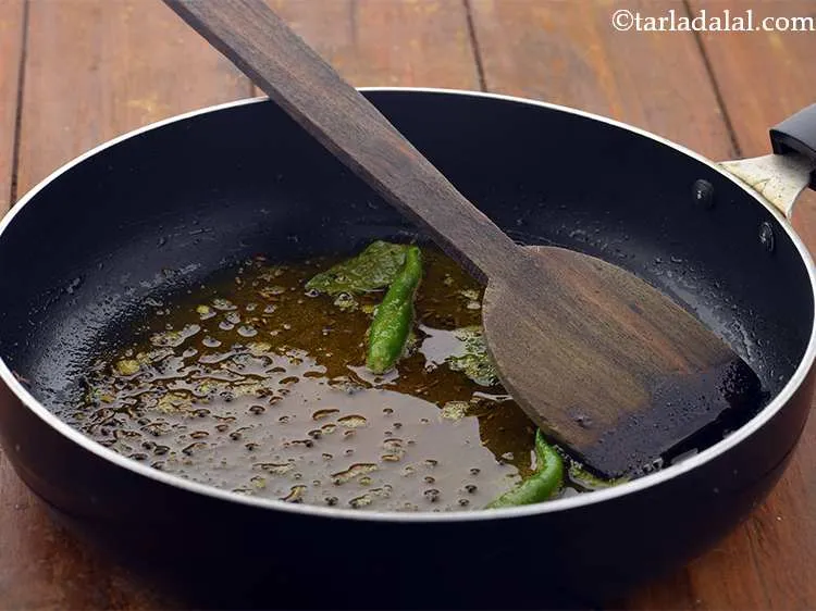 Step 21 – Saut&eacute; on a medium flame for 30 seconds. Stir quickly or the tadka might burn, …