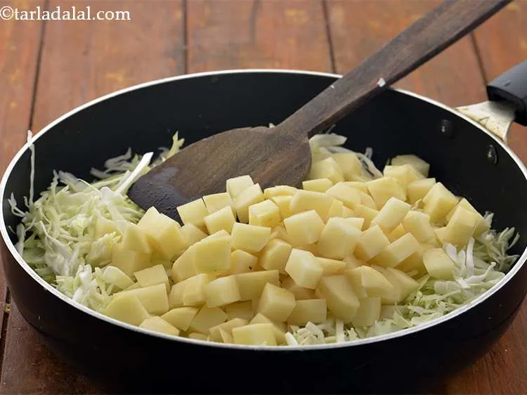 Step 13 – Add the potatoes.