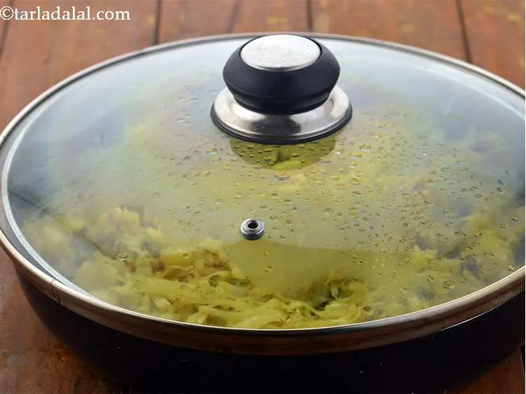 Step 22 – Cover with a lid and cook&nbsp;gobi bateta nu shaak&nbsp;on a medium flame for 10 minutes …