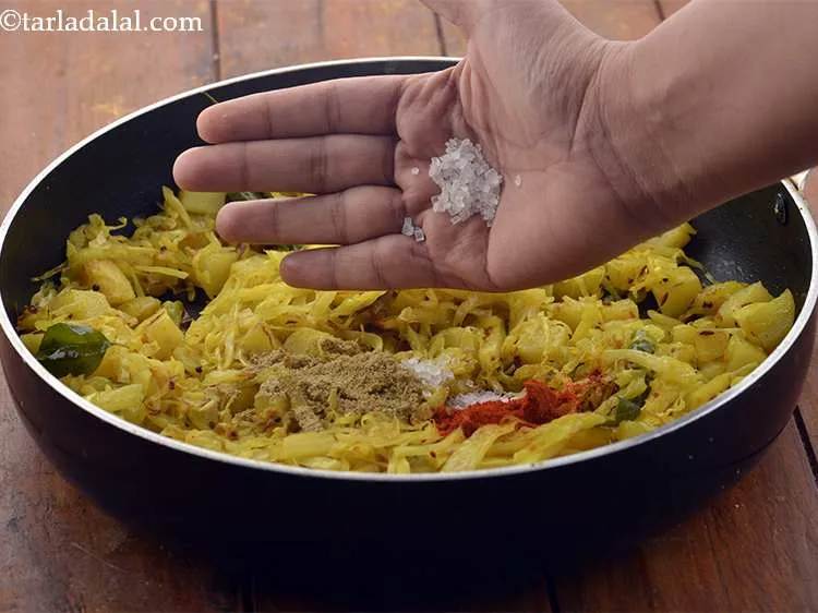 Step 18 – Add the sugar. It provides a pleasant sweetness to the <strong>gobi bateta nu shaak</strong>.