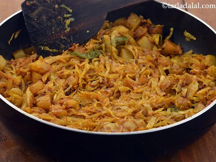 Step 19 – Mix well and cook the cabbage, potato vegetable on a medium flame for more 2 …