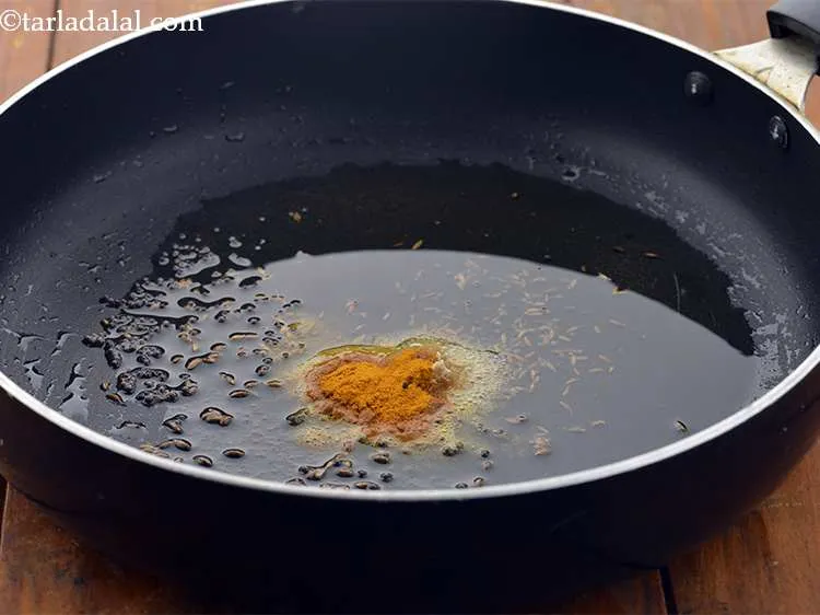 Step 8 – Now, add the turmeric powder.