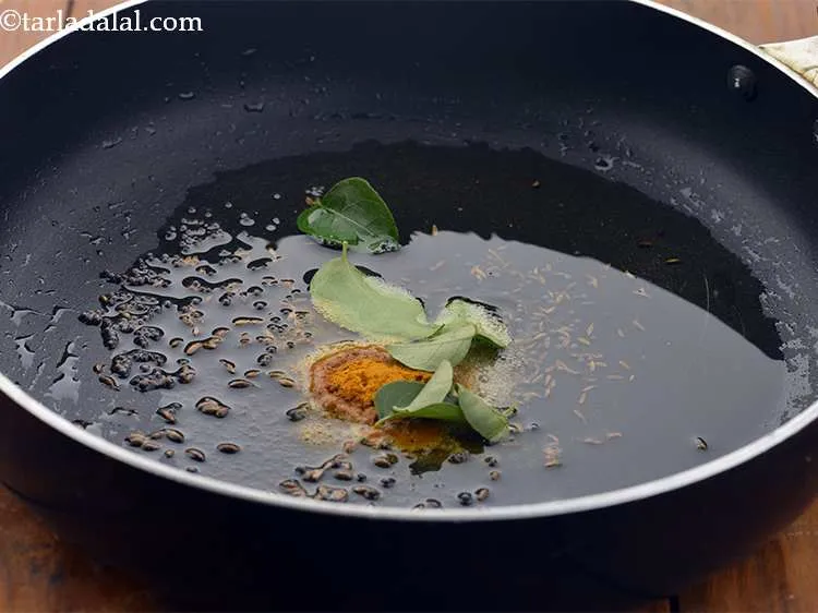Step 9 – Furthermore, add the curry leaves.