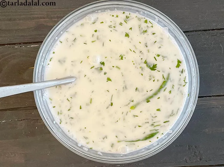 Step 11 – Mix well.&nbsp;Remove the green chillies.&nbsp;