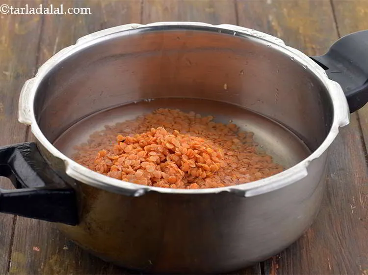 Step 9 – Add the soaked and drained masoor dal.