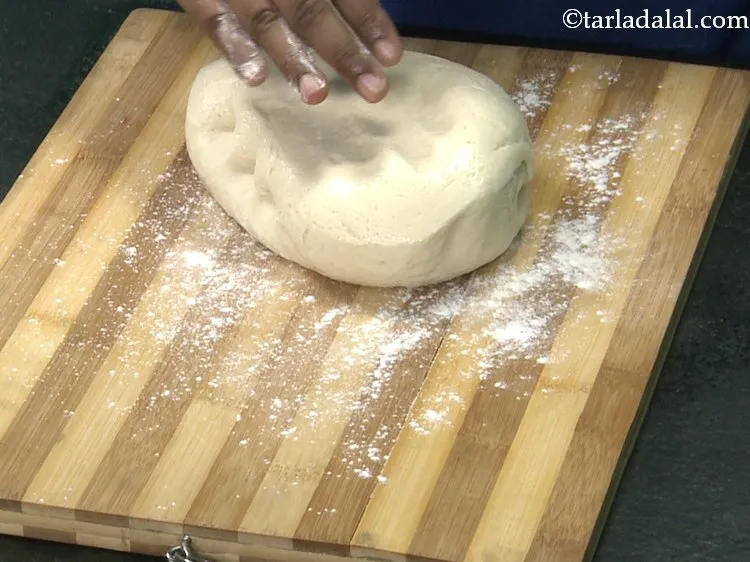 Step 22 – Transfer the dough to a floured board.
