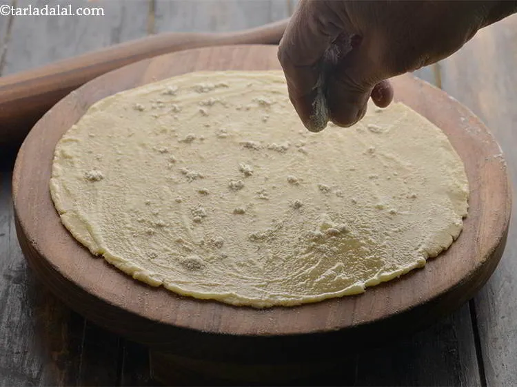Step 13 – Sprinkle a little whole-wheat flour evenly over it.&nbsp;