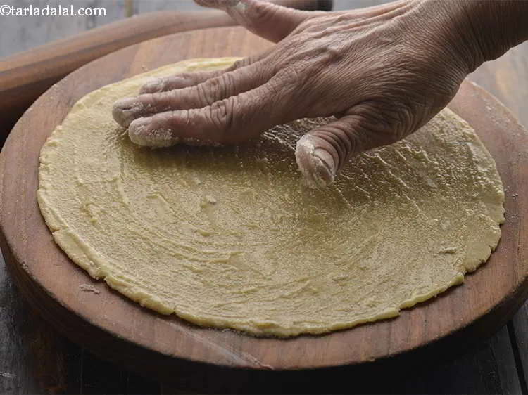 Step 14 – Spread it lightly. You can use a small strainer to spread the flour evenly or …