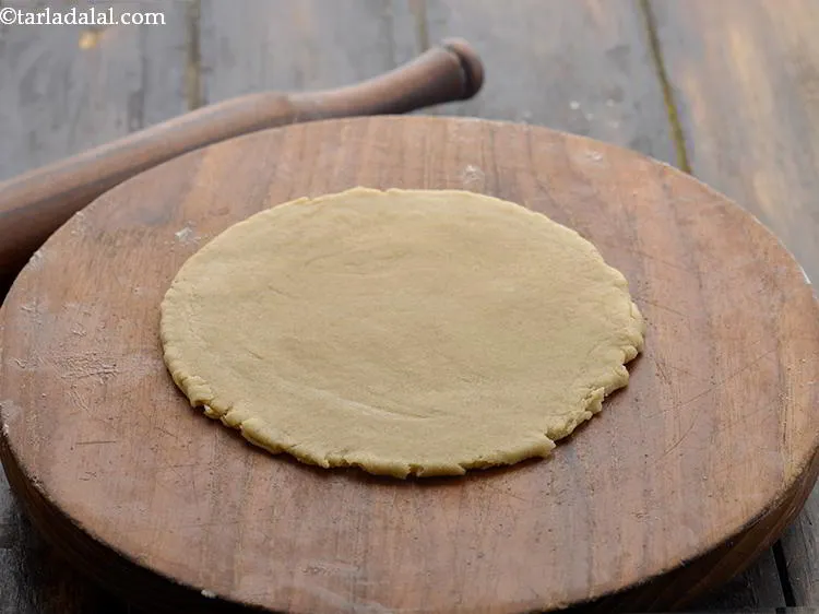 Step 19 – Gently roll into a 150 mm. (6&rdquo;) diameter circle using a little whole-wheat flour for …