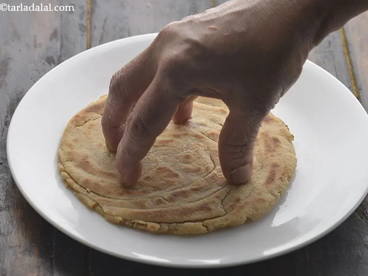 Step 23 – Remove the&nbsp;<strong>laccha paratha | Punjabi lachedar&nbsp;paratha | Indian layered paratha |</strong><strong>&nbsp;</strong>on a plate.