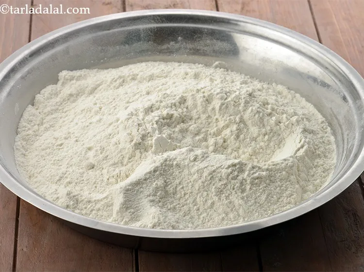 Step 8 – In another bowl, take the plain flour. To make a <a href="https://www.tarladalal.com/Whole-Wheat-Ladi-Pav-Eggless-Homemade-Laddi-Pav-Buns-41387r" target="_blank">healthy whole wheat …