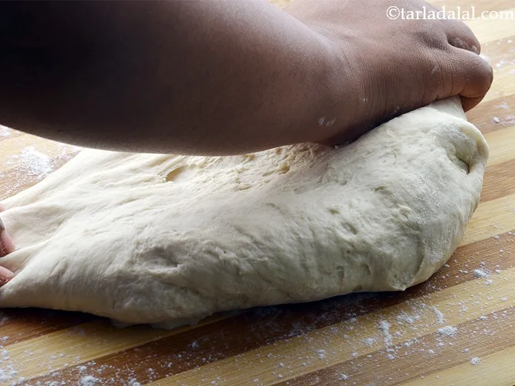 Step 23 – Knead again for 5 minutes using little flour by stretching it and folding it back …