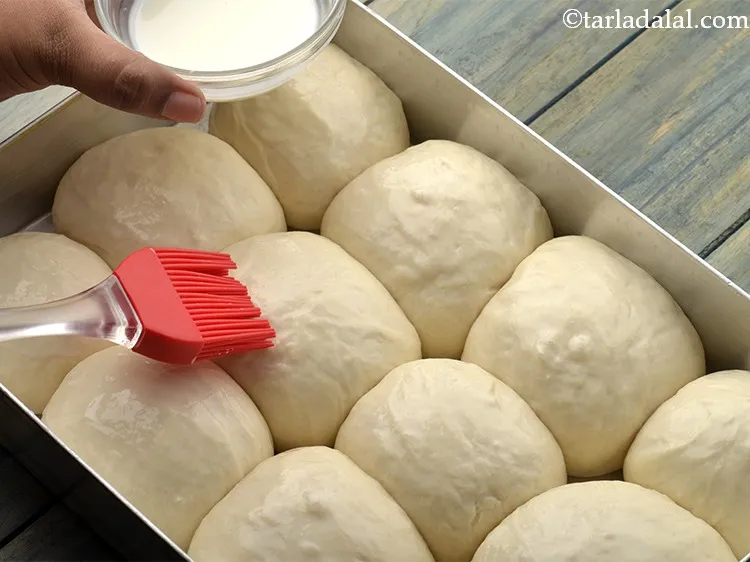 Step 30 – Brush the dough with the milk.