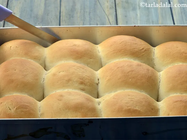 Step 32 – After baking, loosen the edges with the help of a knife. Our <strong>baked ladi pav …