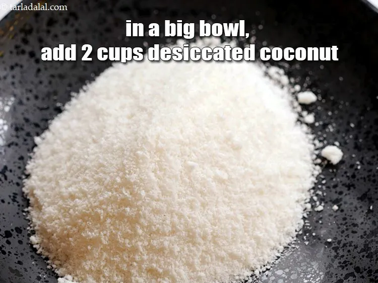 Step 3 – In a big bowl, add 2 cups <a href="https://www.tarladalal.com/glossary-desiccated-coconut-272i">desiccated coconut</a>.