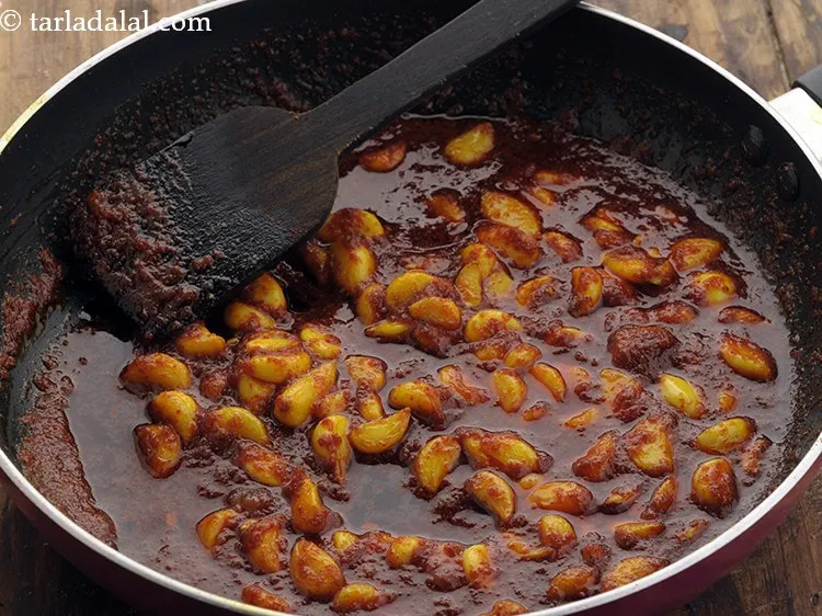 Step 17 – Mix well and cook on a slow flame for 2 minutes or till the jaggery …