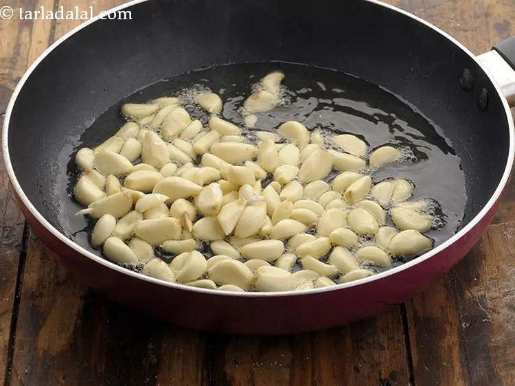 Step 9 – Add garlic cloves. Smash the garlic with the back of a knife to quickly remove …