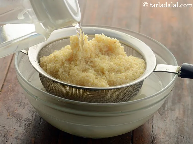 Step 6 – Refresh using cold water to stop the internal cooking of Dalia and prevent it from …