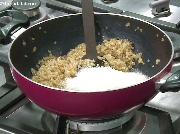 Step 9 – Add sugar. You can even make use of jaggery to make <strong>lapshi</strong>.