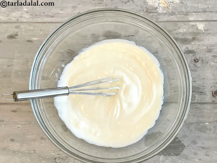 Step 11 – Beat the curds with a whisk.