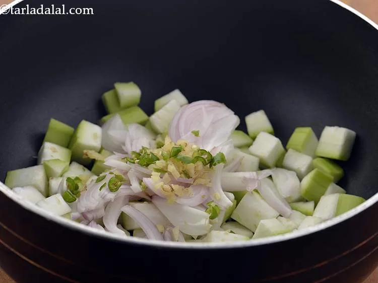 Step 10 – Also, add the green chillies and ginger.