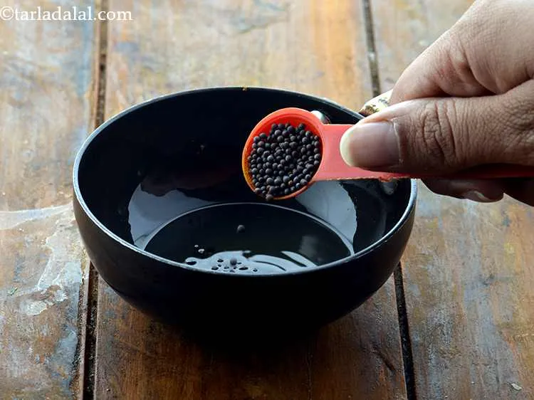 Step 19 – Once the oil is hot, add the mustard seeds.