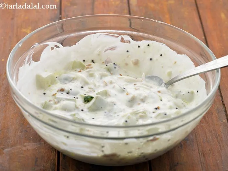 Step 22 – Mix&nbsp;<strong>Lauki ka Raita recipe (Dudhi Raita)</strong>&nbsp;well with the help of a spoon.