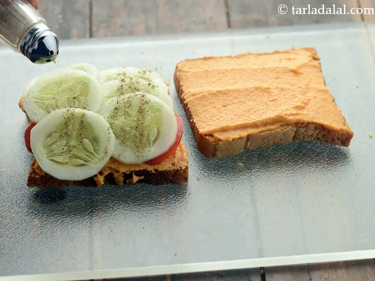 Step 24 – Also, sprinkle pepper powder evenly over it.&nbsp;