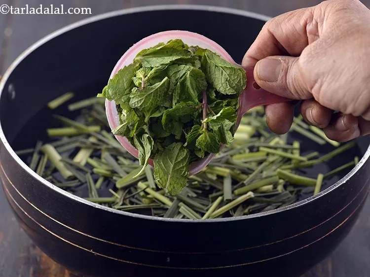 Step 7 – Add mint leaves. Same with pudina, they have been picked, washed and then added to …