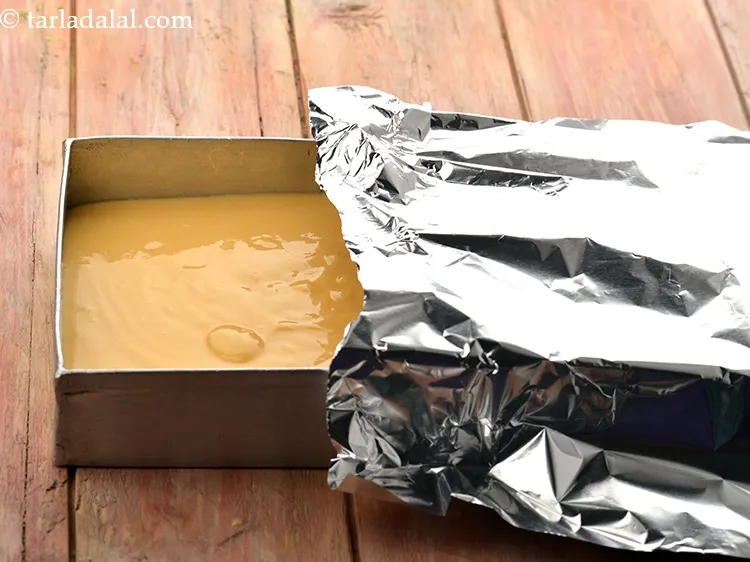 Step 22 – Transfer the mixture back into the same aluminium shallow container.