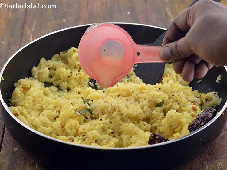 Step 21 – Add the lemon juice to <strong>Lemon Rice</strong>.&nbsp;