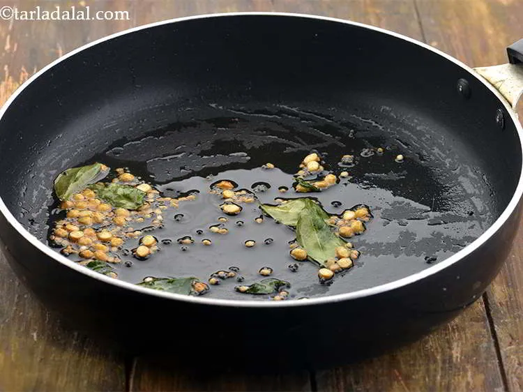 Step 14 – Saut&eacute; on a medium flame for 1 minute or till the dals turn light brown …