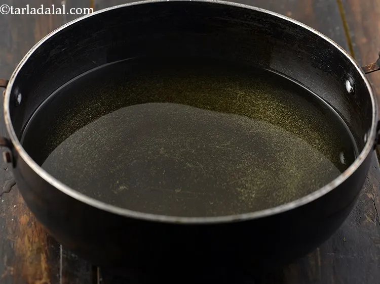 Step 28 – Heat the oil in a deep non-stick pan on a medium flame and add 3 …