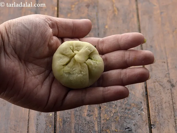 Step 26 – Bring together all the sides, seal it tightly, pinching in the center. Pinch it well …