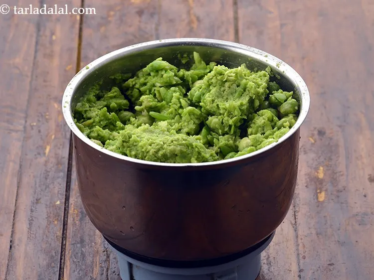 Step 11 – Add the coarsely blended toovar and green pea mixture.