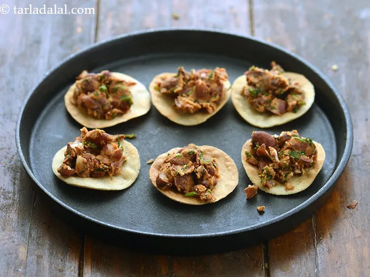 Step 30 – Top each papadi with &frac12; tbsp of the rajma topping.