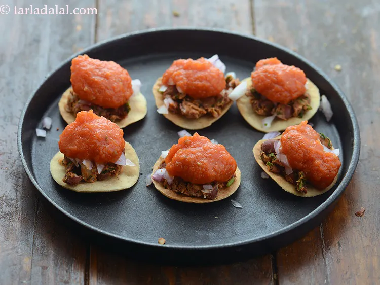 Step 32 – Drizzle &frac12; tsp of tomato chutney.&nbsp; The quantity of chutney can be adjusted as per …