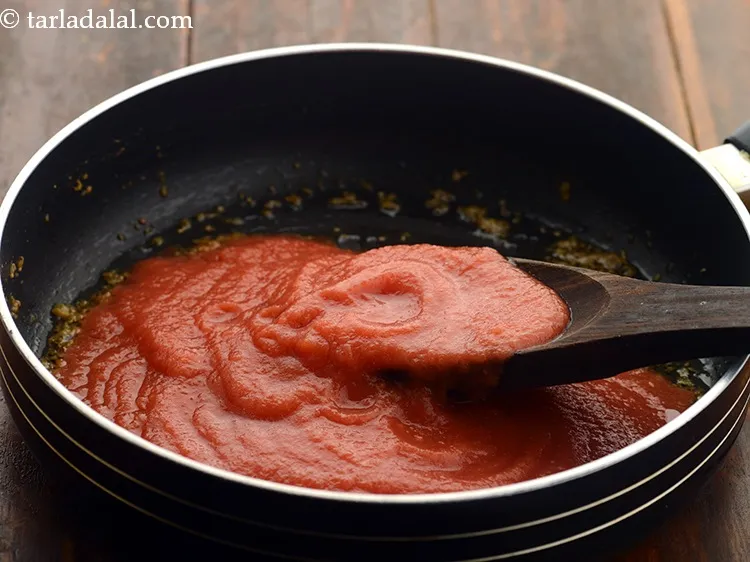 Step 7 – Add fresh tomato pulp. We have prepared this pulp after blanching the tomatoes. To know …