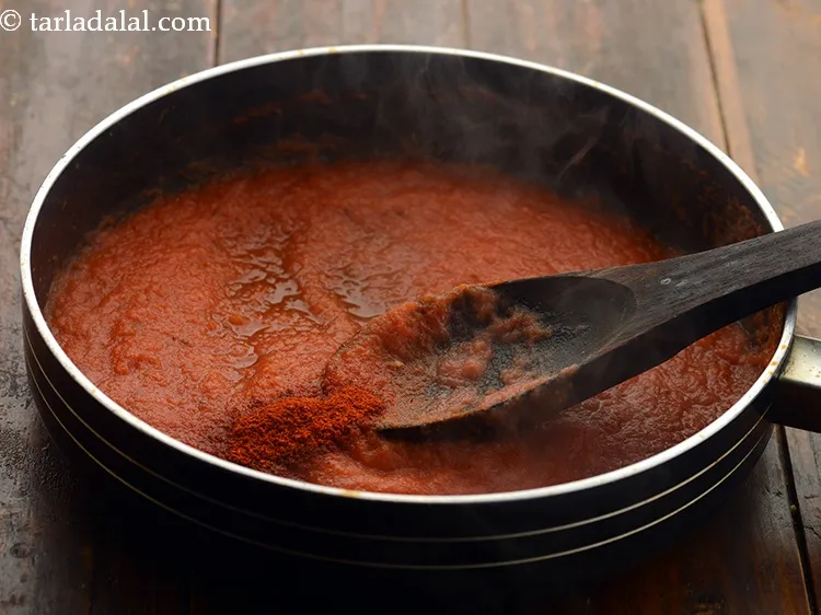 Step 9 – Once the water has evaporated and the tomato pulp has reduced &amp; changed colour, add …