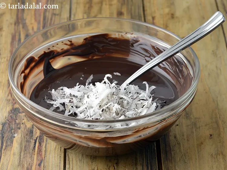 Step 6 – Once cooled, add 1/4 cup&nbsp;<a href="https://www.tarladalal.com/glossary-grated-dry-coconut-2272i">grated dry coconut (kopra)</a>.