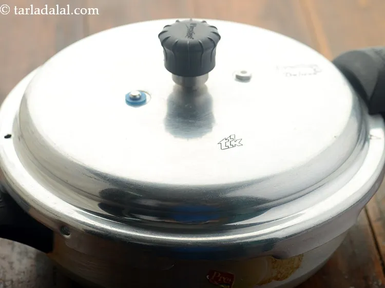 Step 8 – Pressure cook for 4 whistles or until the chickpeas are soft.