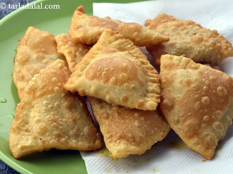 Step 57 – Add 2 lukhmis at a time, on a medium flame till they turn golden brown …