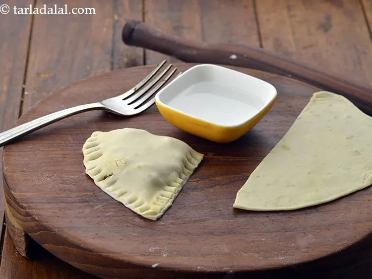 Step 54 – Fold it and seal it tightly using little water and press both the sides with …