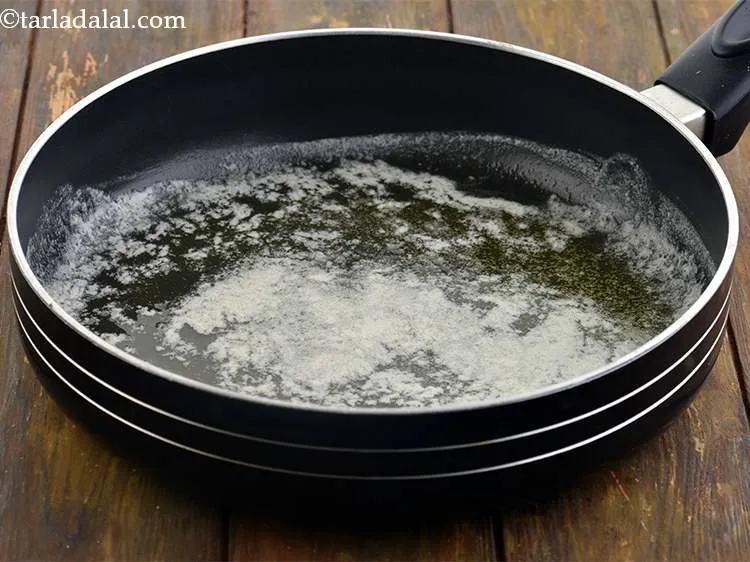 Step 11 – To make the <strong>Macaroni Hot pot</strong>, first heat the butter in a broad non-stick pan.